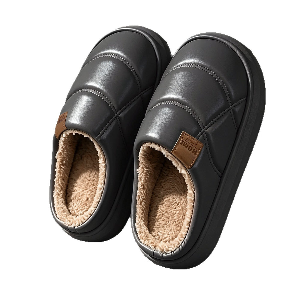 A pair of black slip-on winter slippers with a plush beige sherpa lining, shown from a top-down angle on a white background.