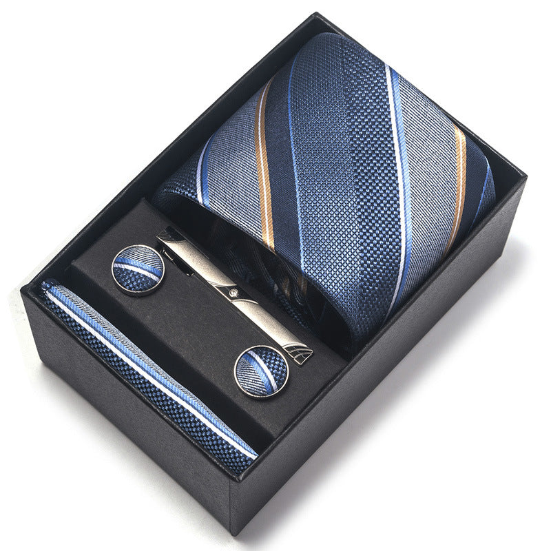 Blue striped tie and cufflinks set in a black box on a white background