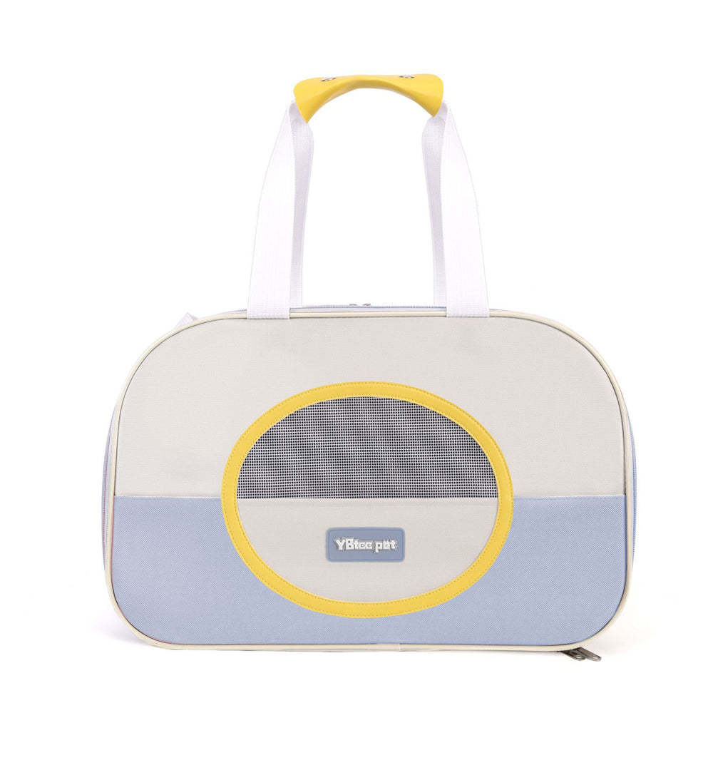 Pet carrier with a yellow handle and circular mesh door on a white background