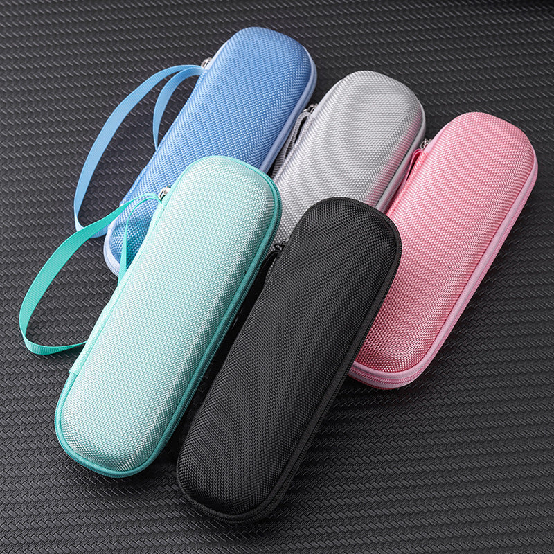 Five colorful hard-shell carrying cases on a textured surface