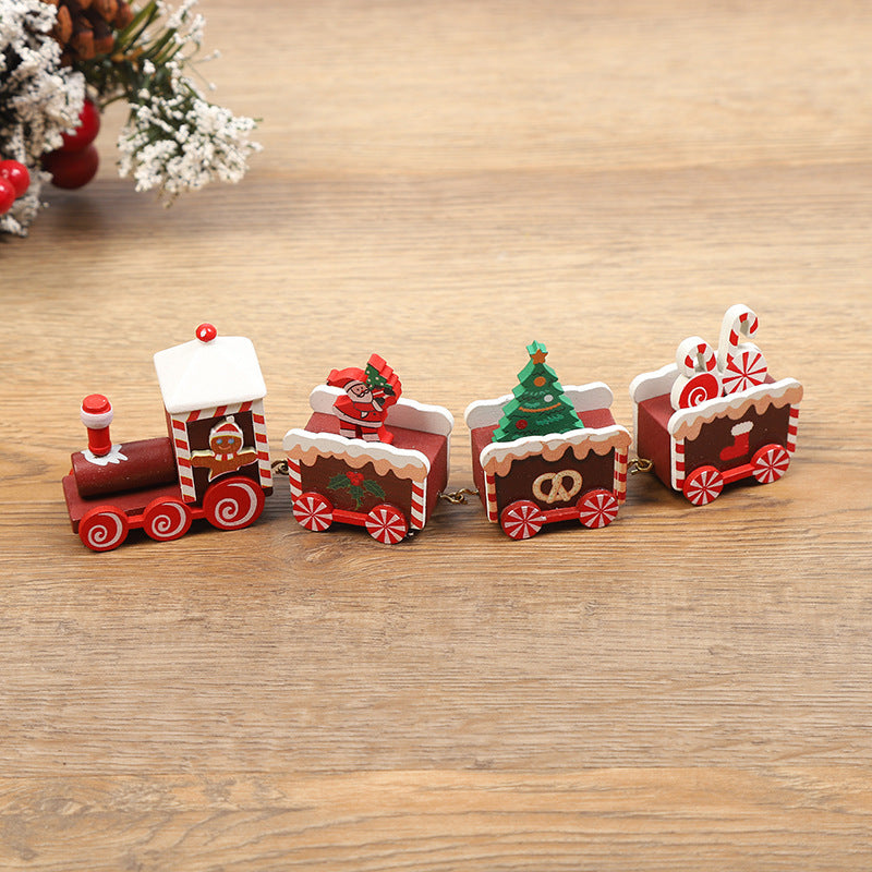 Decorative Christmas train set on a wooden surface