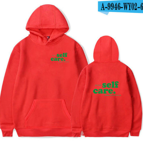 Red hoodie with 'self care.' text on front and back, on a white background.