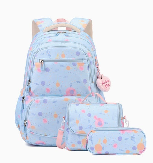 A pastel blue backpack set with matching pouches, featuring a colorful polka dot pattern in pink, orange, and purple, with a pink heart-shaped charm that reads 'Bachelorette Girl'.