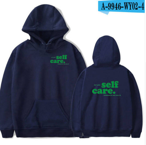 Navy blue hoodie with 'self care' text on front and back, on a white background.