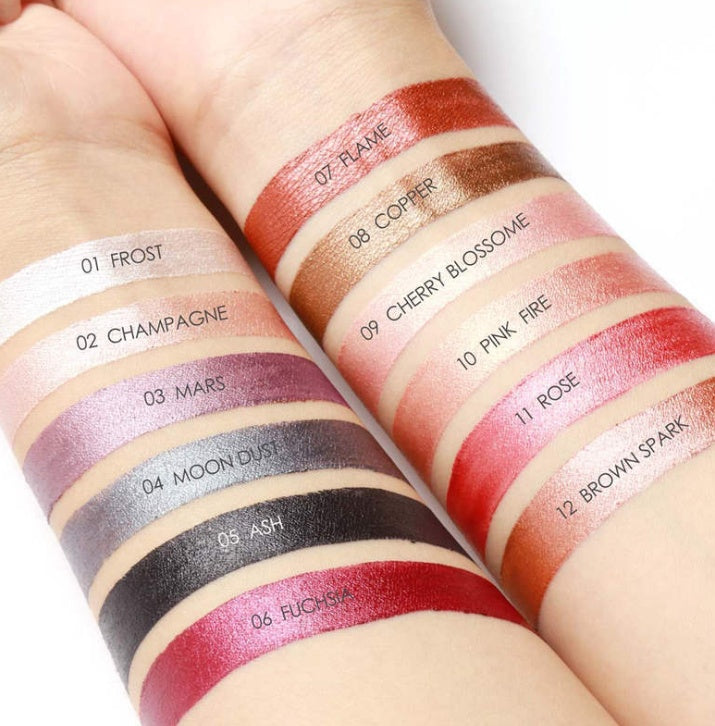 Set of lip swatches on a person's arm with color names and numbers.