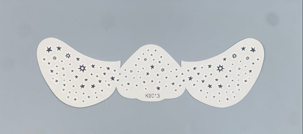 Mustache-shaped stencil with star patterns on a gray background