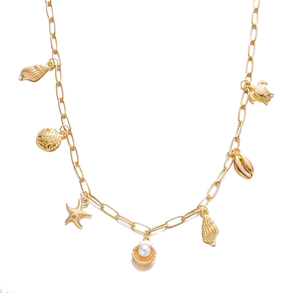 Gold necklace with shell and starfish charms on a white background