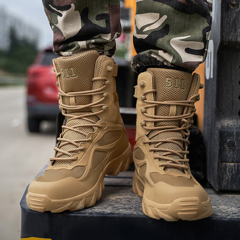 Tan tactical boots with laces worn by a person in camouflage pants, standing on a vehicle.