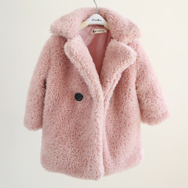 Pink fluffy coat on a hanger against a white background
