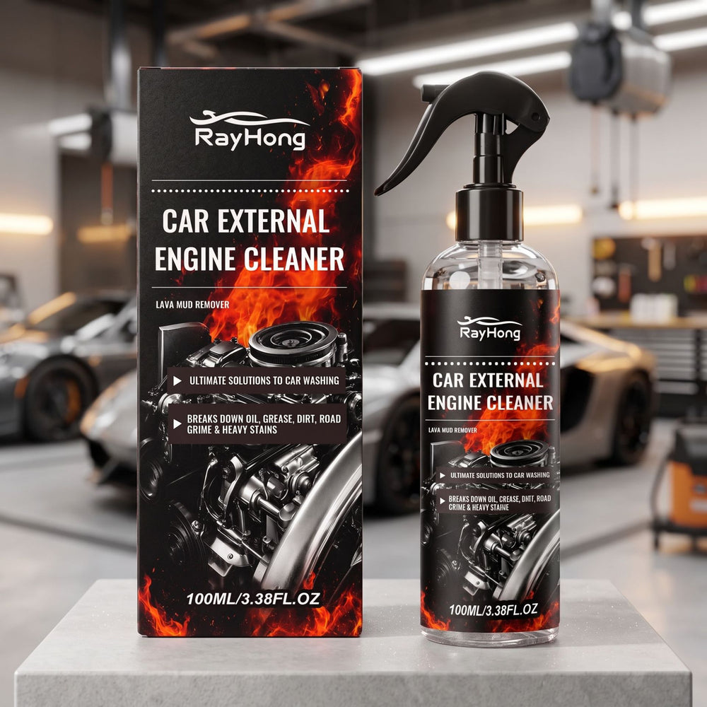 RayHong Car External Engine Cleaner shown as a clear spray bottle with a black trigger top next to its black retail box, both featuring fiery orange flame graphics and a car engine illustration, displayed on a light gray pedestal in a blurred garage setting.