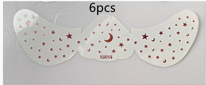 Set of six star and moon patterned eye patches on a white background