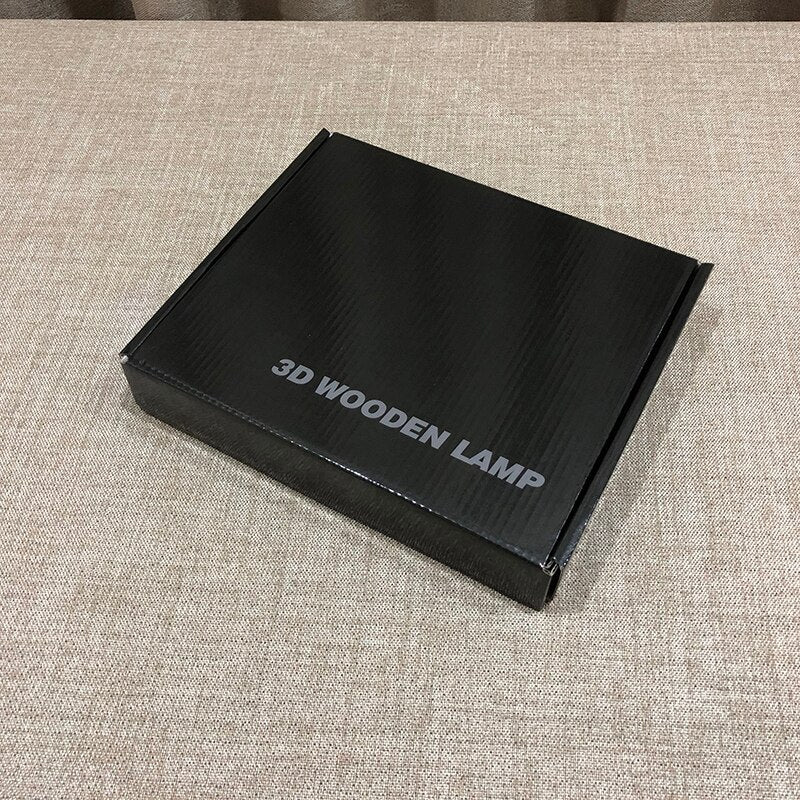 Black box labeled '3D Wooden Lamp' on a textured surface