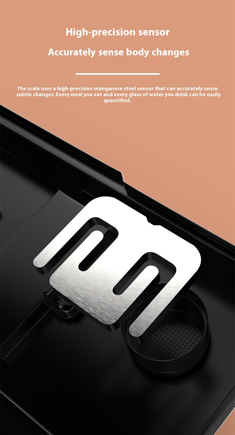 A stainless steel body scale with a large, stylized 'm' symbol on the platform, shown on a black surface against a split peach and black background with promotional text.