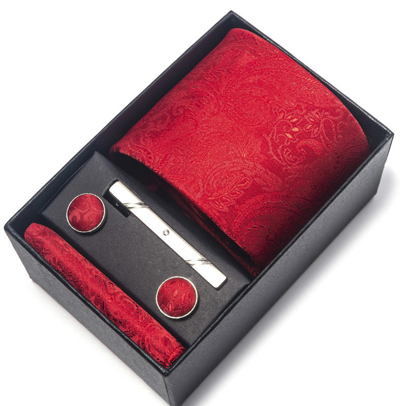 Red paisley tie set with tie clip and cufflinks in a black box on a white background