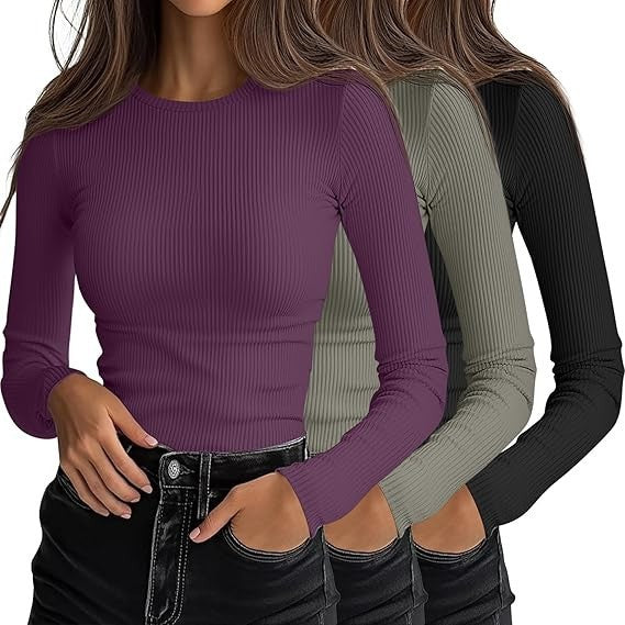 Three long-sleeve shirts in purple, gray, and black on a white background