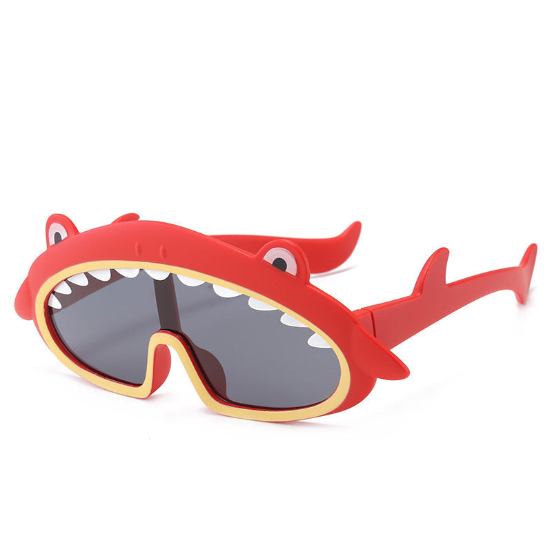 Red shark-shaped sunglasses on a white background