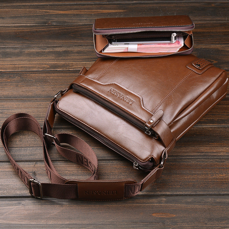 Brown leather shoulder bag with a smaller pouch on a wooden surface
