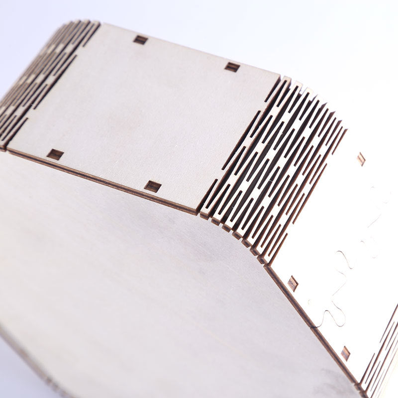 Close-up of a CD with a hexagonal design on a white background