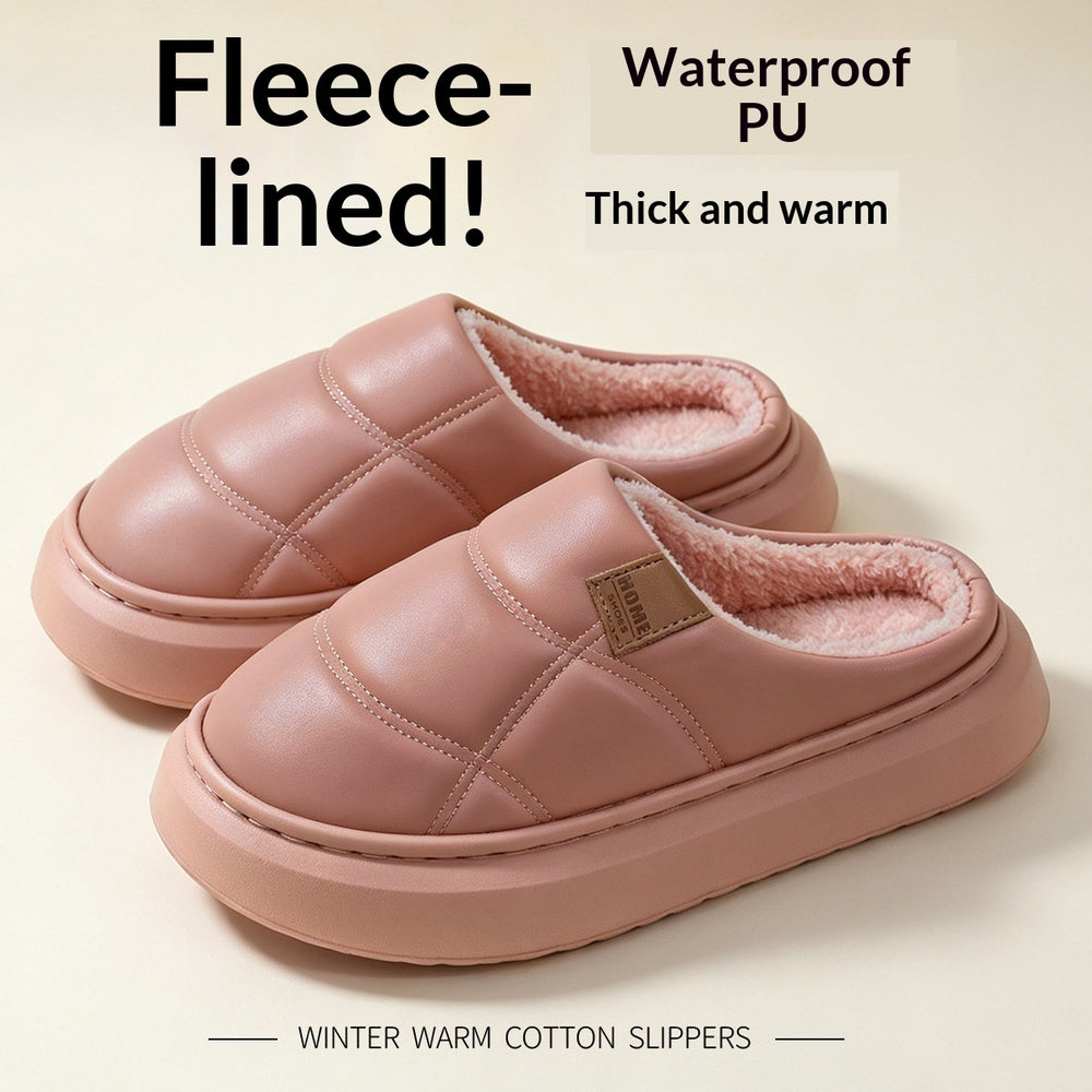 A pair of pink fleece-lined slip-on slippers with quilted stitching and a soft pink interior, shown on a light beige background with promotional text reading 'Fleece-lined!', 'Waterproof PU Thick and warm', and 'WINTER WARM COTTON SLIPPERS'.