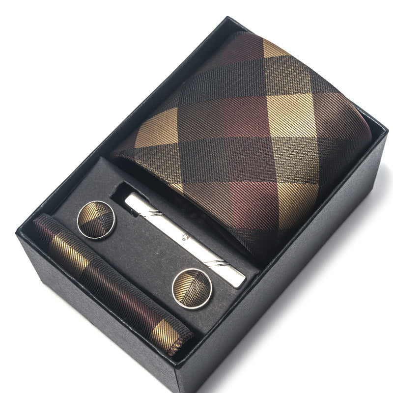 Plaid tie set with cufflinks and tie clip in a black box on a white background