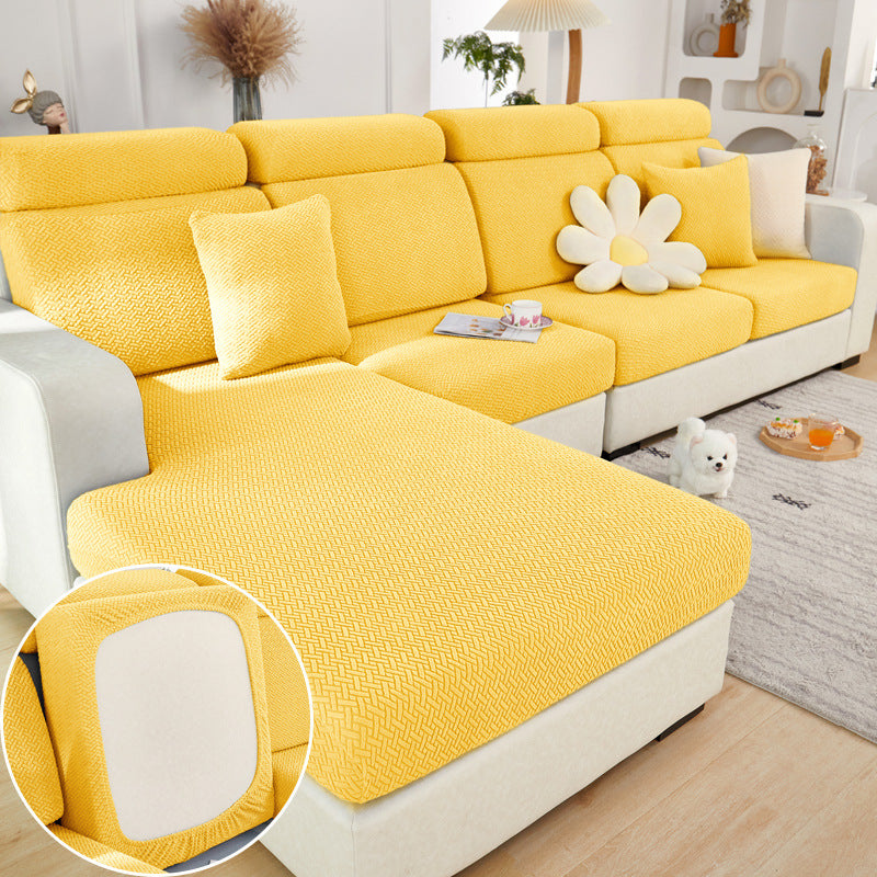 Yellow sofa cover on a sectional sofa with a close-up of the fabric texture.