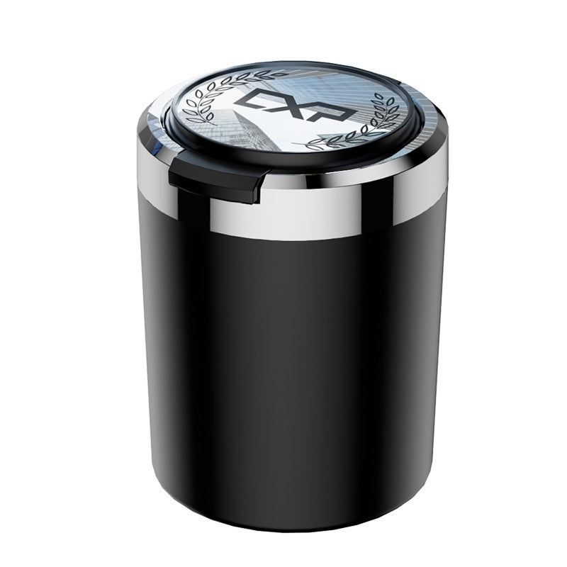 Black cylindrical container with silver lid on a white background