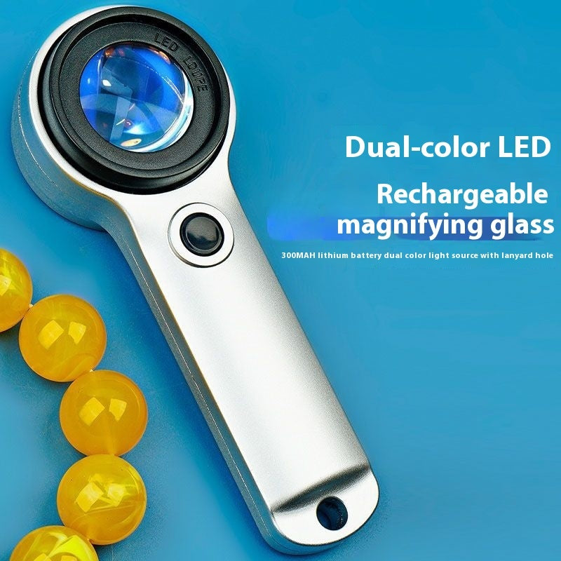 Rechargeable magnifying glass with dual-color LED on a blue background