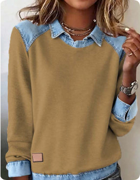 Brown sweater with denim collar and cuffs worn by a person.