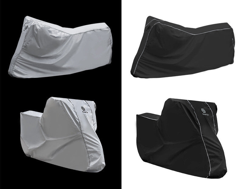 Two pairs of black and gray saddle covers on a black and white background