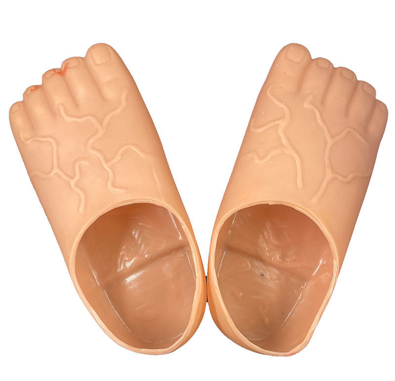 A pair of peach-colored silicone foot-shaped molds or molds for foot exercises, shown against a plain white background.