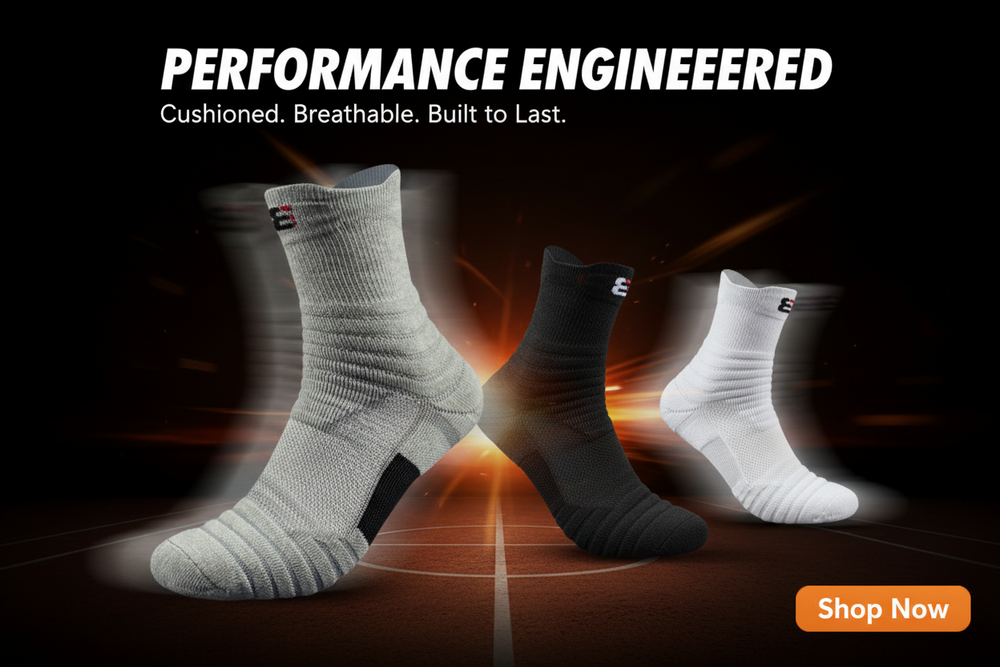 Three athletic crew socks in white, black, and gray are shown floating against a dark background with orange light effects and the text 'PERFORMANCE ENGINEERED' and a 'Shop Now' button.