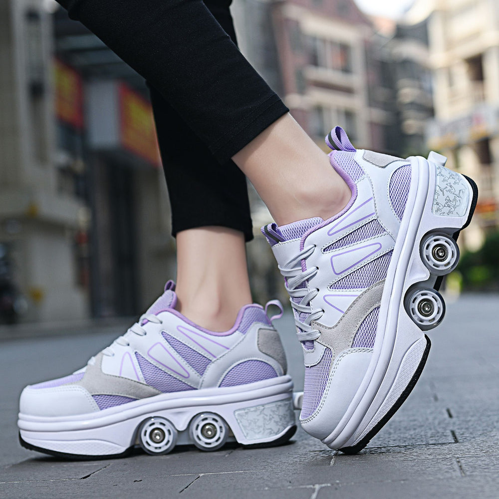 Person wearing white and purple sneakers with roller wheels on a city street.