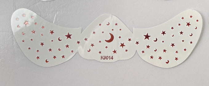Three angel wing-shaped stickers with red stars and crescent moons on a gray background.