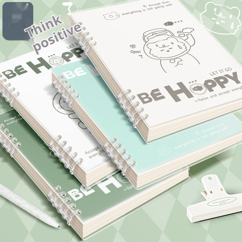 Notebooks with 'Be Happy' and motivational text on a green background