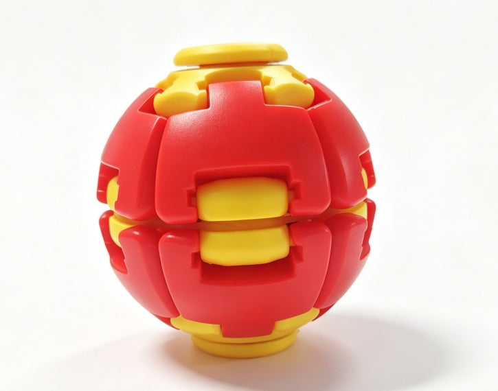 A red and yellow interlocking ball-shaped toy or puzzle, photographed on a clean white background.