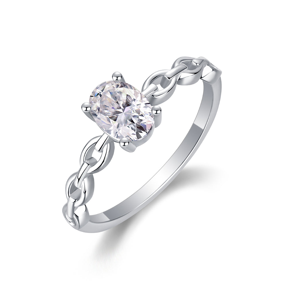 Silver ring with a heart-shaped diamond on a white background