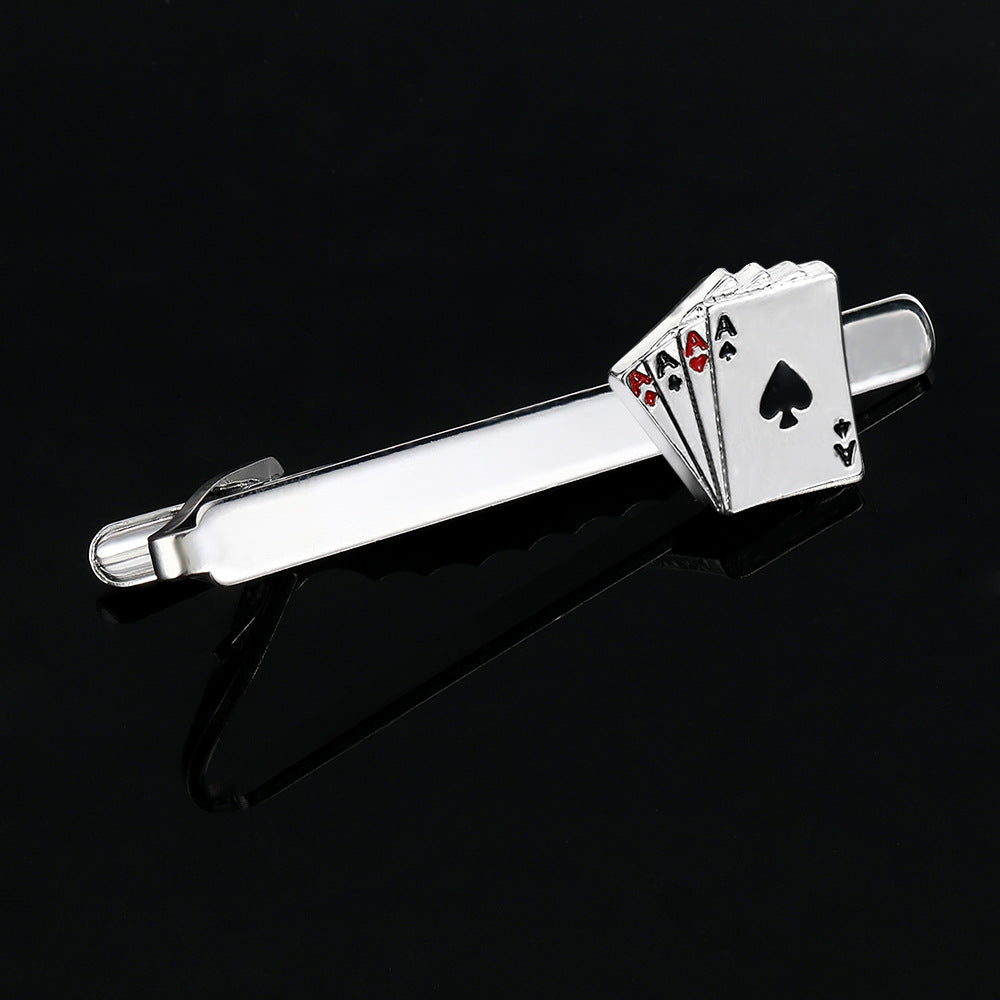 Silver tie clip with playing card design on a black background