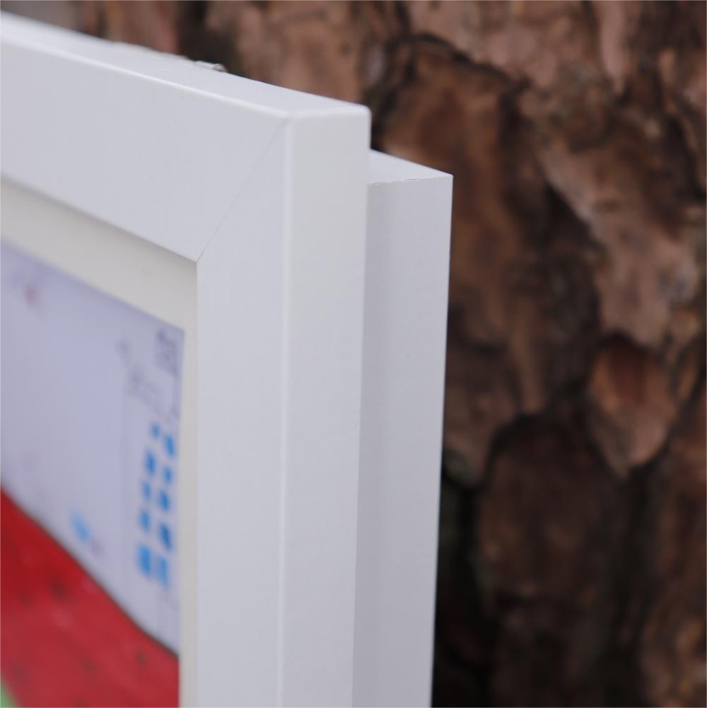 Close-up of a white frame with a blurred background