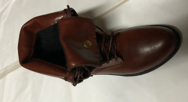 Brown leather boot with a button on a white background
