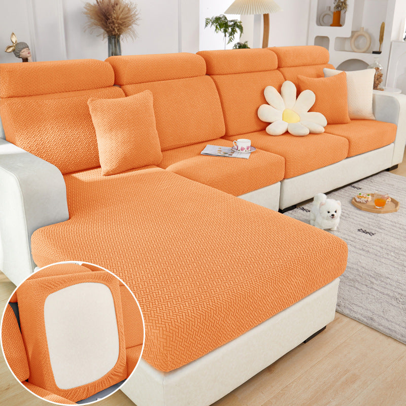 Orange sectional sofa with a close-up of the fabric texture in a living room setting.