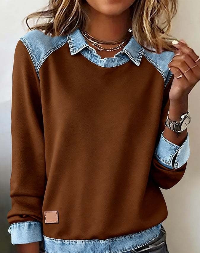 Brown sweatshirt with denim collar and cuffs worn by a person.