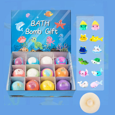 Box of bath bombs with colorful packaging and small bath bombs displayed on a blue background.