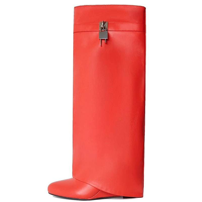 Red knee-high boot with a silver buckle on a white background