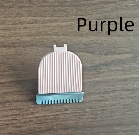 White grooming brush with blue handle on a wooden surface, labeled 'Purple'.