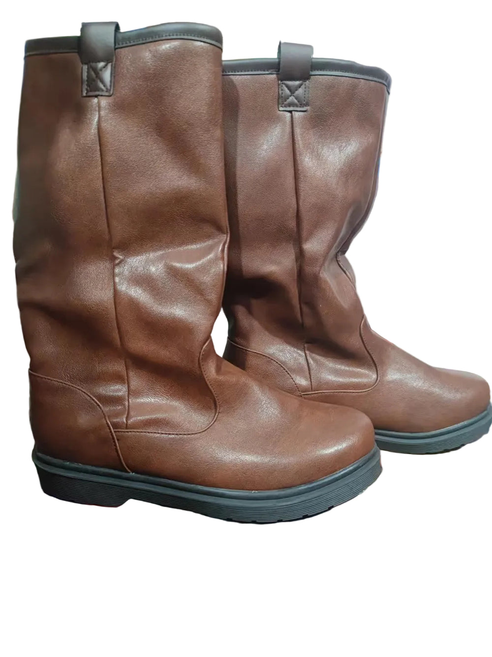 Pair of brown leather boots on a colorful surface with a blurred background