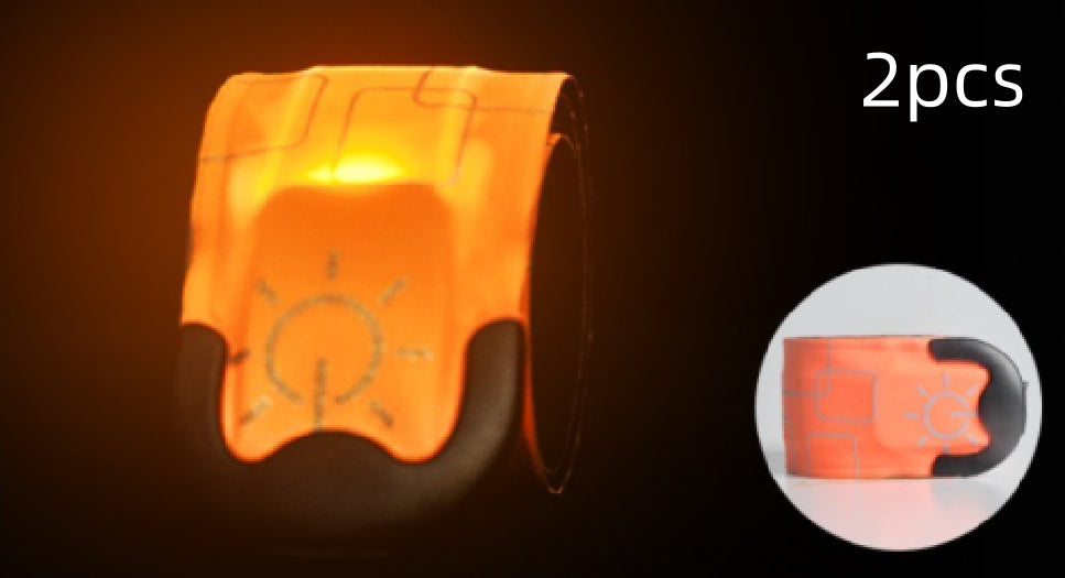 Orange reflective safety vest with a light bulb symbol on a dark background