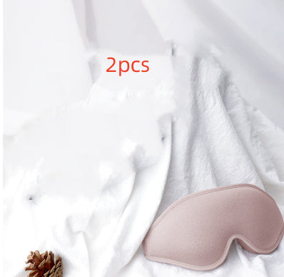 Pink eye mask on a white fabric background with '2pcs' text.