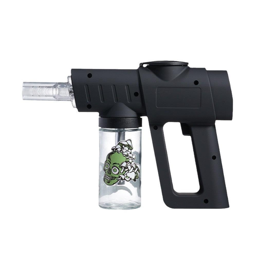 Black handheld device with a clear container featuring a green design on a white background