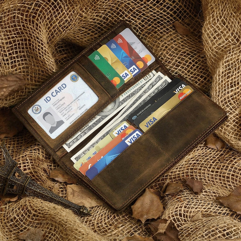 Brown leather wallet with multiple cards on a textured fabric background