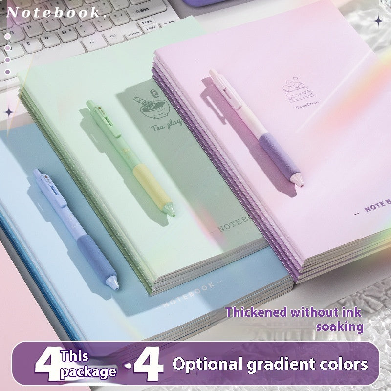 Set of notebooks and pens with gradient colors on a desk